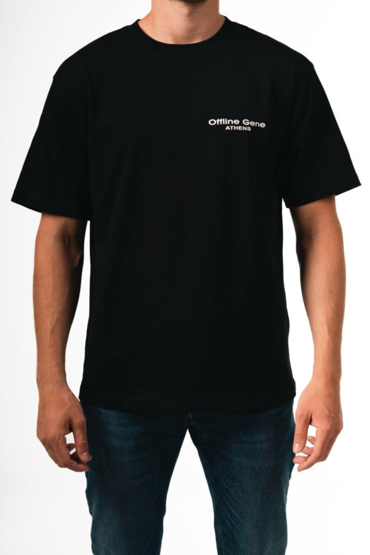 Person wearing a black t-shirt with a logo on a white background
